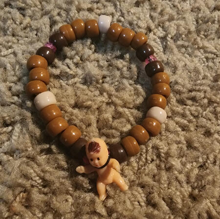 single with special beads and charm = $3